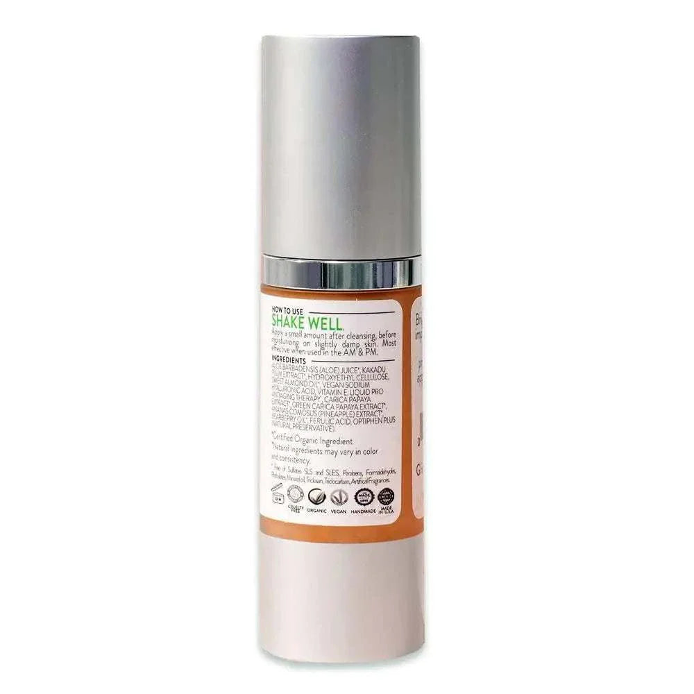 Organic Face Serum bottle with Silver pump cap and label detailing ingredients and usage instructions