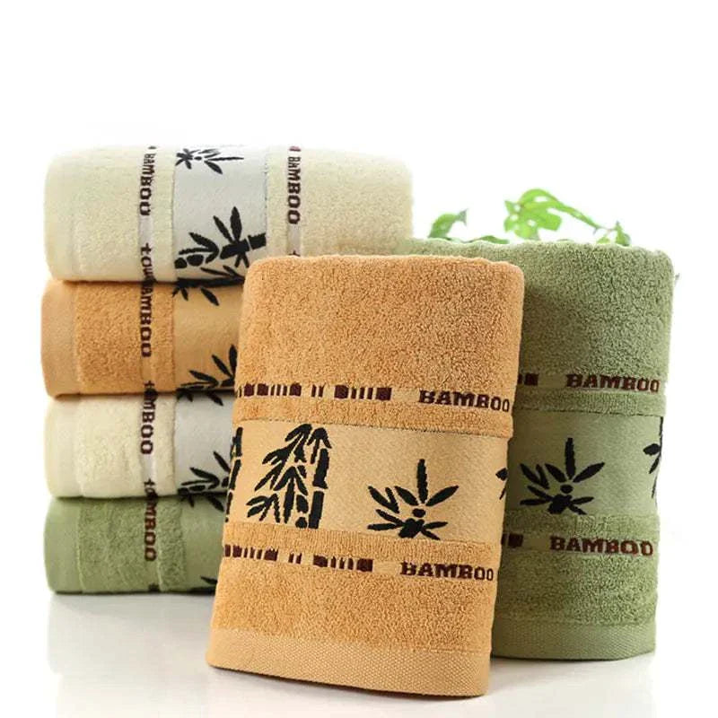 Soft and absorbent bamboo fiber towels in khaki, green, and white, lightweight and eco-friendly with antibacterial properties