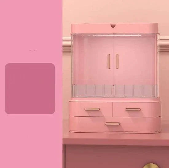 Pink plastic desktop jewelry and skincare organizer with multiple compartments and drawers for cosmetics and essentials storage