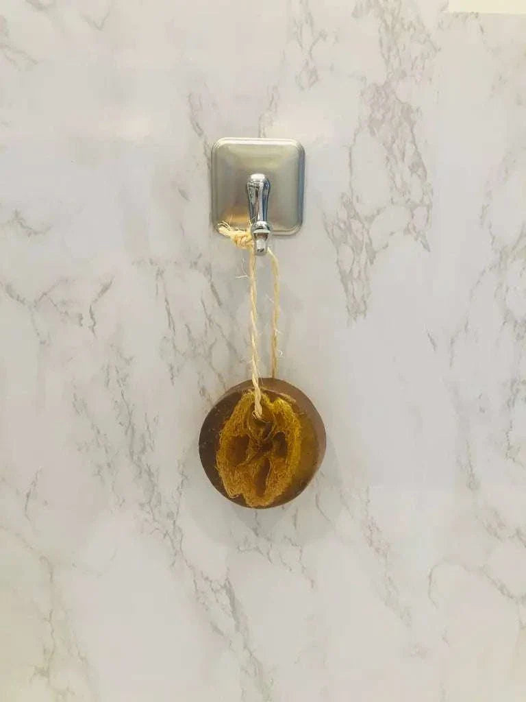 Pristine Soap Bar with natural green clay, bamboo, green tea, and loofah hanging on hook
