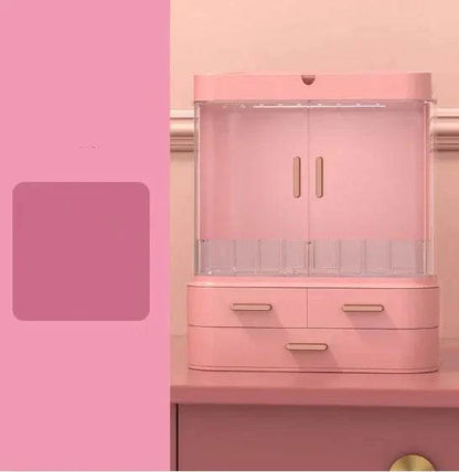 Pink plastic desktop jewelry and skincare organizer with multiple compartments and drawers for cosmetics and accessories storage