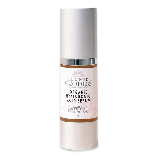 bottle of Glimmer Goddess Organic Hyaluronic Acid Serum with Vitamin C and botanical extracts for skin hydration and plumping