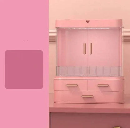 Pink desktop jewelry and skincare organizer with multiple compartments and drawers for cosmetics and accessories storage
