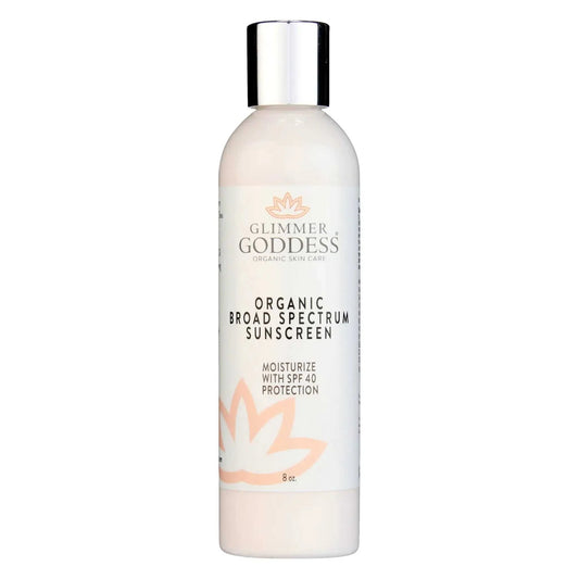 bottle of Glimmer Goddess Organic Broad Spectrum Sunscreen lotion with SPF 40 and moisturizing formula